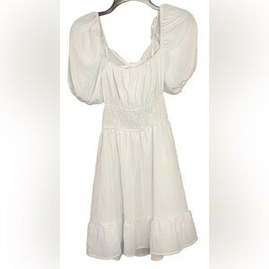 NWOT. White summer dress. Ruffle sleeves. Open back with bow. Size 6 / medium.
